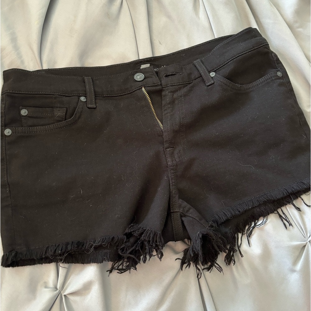 Black Jean shorts with torn ruffles on ends